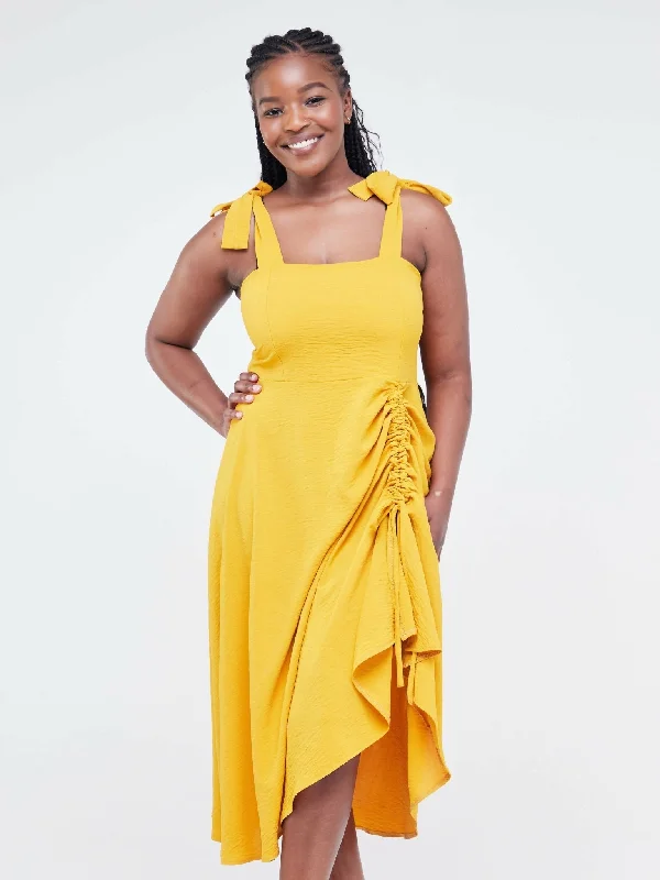 Midi dresses with ruffled bodices for a more pronounced feminine lookLadies & Linen Midi Dress - Yellow Midi dresses with ruffled bodices for a more pronounced feminine lookLadies & Linen Midi Dress - Yellow