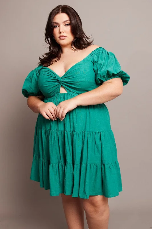 Mini dresses with tiered skirts for added volumeGreen Cut Out Twist Mini Dress